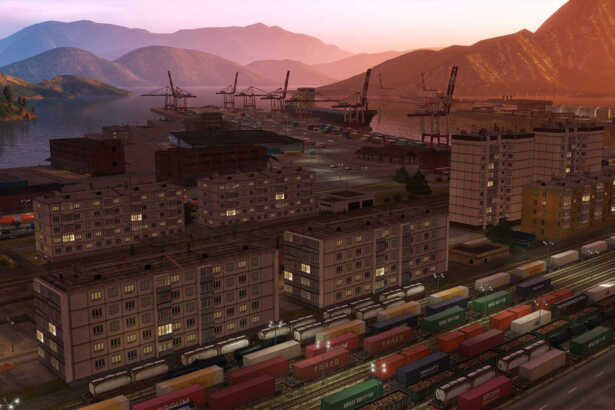 Derail Valley Simulator Screenshot Train Cars Harbor Port City Buildings Sunset Sunrise Lighting